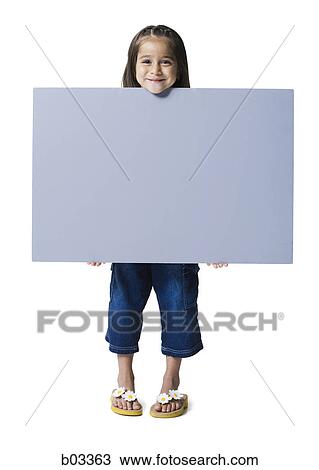 Stock Image - Portrait of a girl holding a blank sign. Fotosearch