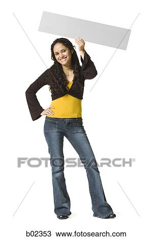 Portrait of a young woman holding a blank sign View Large Photo Image Stock Image - Portrait of a young woman holding a blank sign. Fotosearch