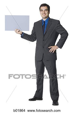 Businessman holding a blank sign View Large Photo Image Picture - Businessman holding a blank sign. Fotosearch