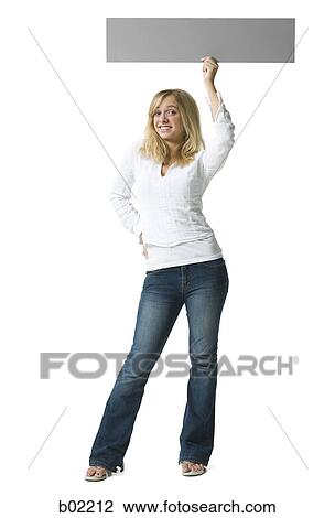 Portrait of a young woman holding a blank sign View Large Photo Image Stock Image - Portrait of a young woman holding a blank sign. Fotosearch