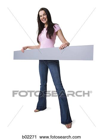 Young woman holding a blank sign View Large Photo Image Stock Image - Young woman holding a blank sign. Fotosearch