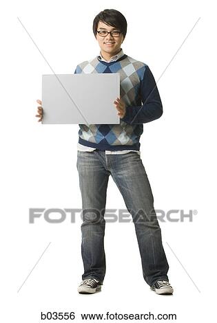 Young woman talking on a mobile phone View Large Photo Image Stock Photograph - Young woman talking on a mobile phone. Fotosearch