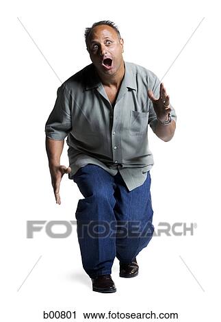 High angle view of a mature man making a face View Large Photo Image Stock Image - High angle view of a mature man making a face. Fotosearch