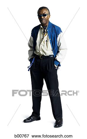 Mature man standing with his hands in his pockets View Large Photo Image Stock Photo - Mature man standing with his hands in his pockets. Fotosearch