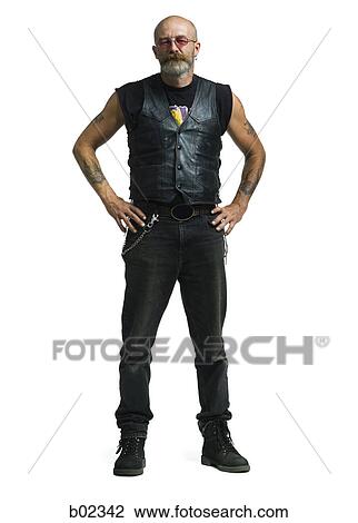 Portrait of a mature man standing with his hands on hips View Large Photo Image Stock Image - Portrait of a mature man standing with his hands on hips. Fotosearch