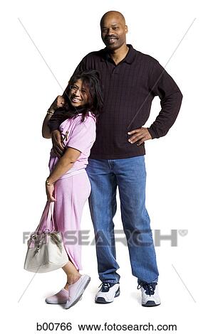 Portrait of a mid adult couple smiling View Large Photo Image Stock Photograph - Portrait of a mid adult couple smiling. Fotosearch