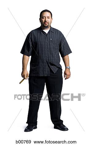 Portrait of a mid adult man holding a cigar View Large Photo Image Stock Photo - Portrait of a mid adult man holding a cigar. Fotosearch