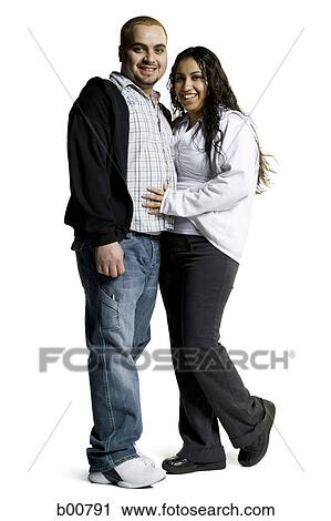 Stock Image - Portrait of a young couple smiling. Fotosearch