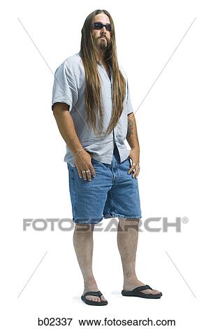 Stock Photo - Portrait of a young man with long hair. Fotosearch