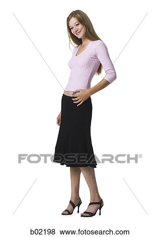 Portrait of a young woman smiling View Large Photo Image Stock Photo - Portrait of a young woman smiling. Fotosearch