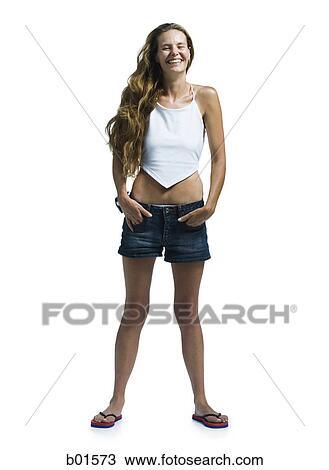 Young woman standing with her hands in her pockets View Large Photo Image Stock Image - Young woman standing with her hands in her pockets. Fotosearch