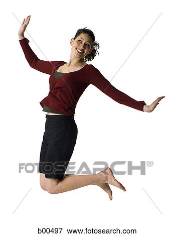 Stock Photo - Close-up of a young woman jumping. Fotosearch