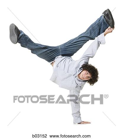 Portrait of a teenage boy performing one armed handstand View Large Photo Image Stock Image - Portrait of a teenage boy performing one armed handstand. Fotosearch