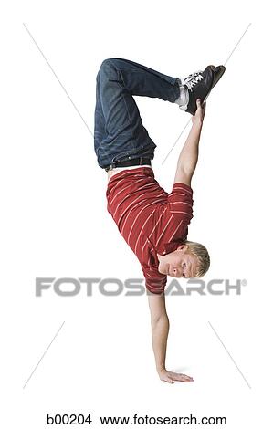 Portrait of a young man doing one handed handstand View Large Photo Image Picture - Portrait of a young man doing one handed handstand. Fotosearch