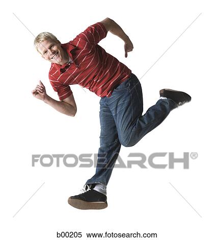 Stock Photography - Portrait of a young man running. Fotosearch