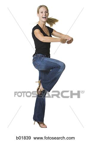 Young woman dancing View Large Photo Image Stock Photo - Young woman dancing. Fotosearch