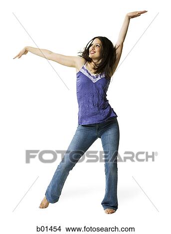 Picture - Young woman dancing with her hand raised. Fotosearch