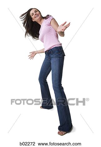 Stock Image - Young woman moving her head, hair flowing. Fotosearch