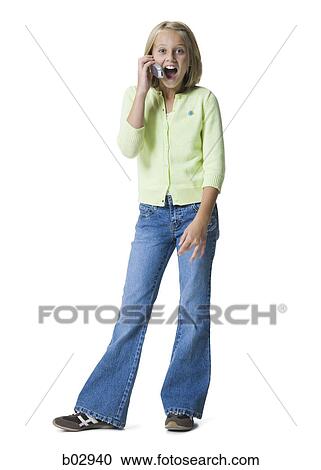 Stock Image - A young girl talking on a mobile phone. Fotosearch
