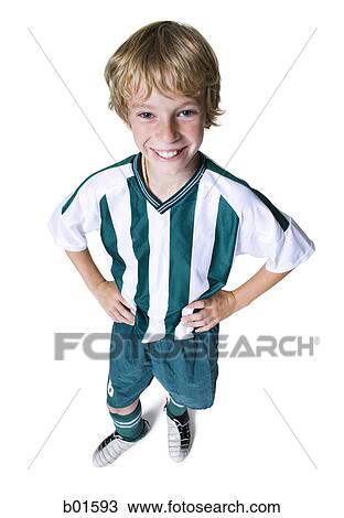 Stock Image - High angle view of a boy wearing soccer uniform. Fotosearch