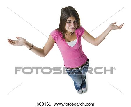 High angle view of a teenage girl standing with her arms raised and smiling View Large Photo Image Stock Photography - High angle view of a teenage girl standing with her arms raised and smiling. Fotosearch