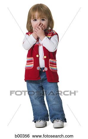 Portrait of a baby girl covering her mouth with her hands View Large Photo Image Stock Photograph - Portrait of a baby girl covering her mouth with her hands. Fotosearch