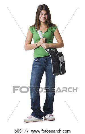Portrait of a teenage girl holding a bag and smiling View Large Photo Image Stock Photo - Portrait of a teenage girl holding a bag and smiling. Fotosearch