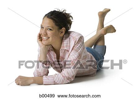 Portrait of a teenage girl lying with her hand on her chin View Large Photo Image Stock Photo - Portrait of a teenage girl lying with her hand on her chin. Fotosearch