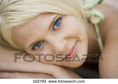 Stock Image - Close-up of a young woman smiling. Fotosearch