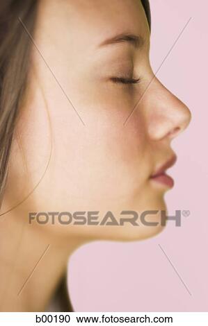 Close-up of a young woman's face View Large Photo Image Stock Image - Close-up of a young woman's face. Fotosearch