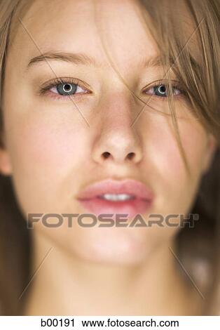Close-up of a young woman's face View Large Photo Image Stock Image - Close-up of a young woman's face. Fotosearch