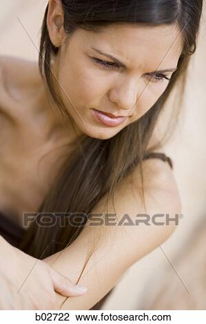 Stock Image - High angle view of a young woman. Fotosearch