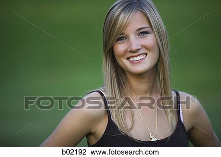 Portrait of a teenage girl smiling View Large Photo Image Stock Image - Portrait of a teenage girl smiling. Fotosearch