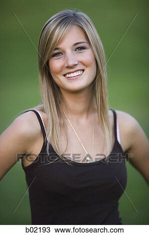 Portrait of a teenage girl smiling View Large Photo Image Stock Image - Portrait of a teenage girl smiling. Fotosearch