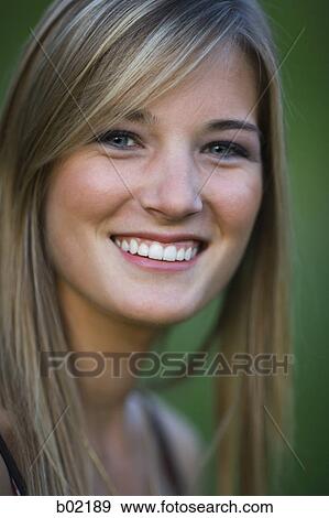 Portrait of a teenage girl smiling View Large Photo Image Stock Photo - Portrait of a teenage girl smiling. Fotosearch