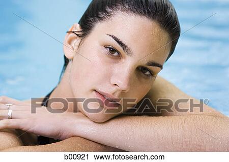 Portrait of a young woman in a swimming pool View Large Photo Image Stock Image - Portrait of a young woman in a swimming pool. Fotosearch