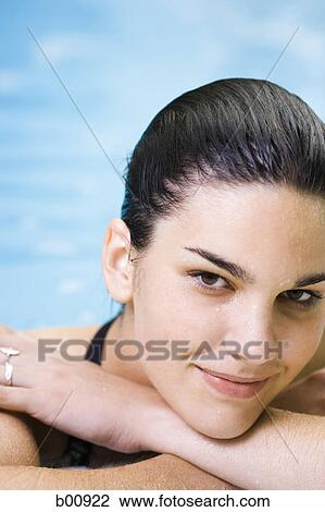 Portrait of a young woman in a swimming pool View Large Photo Image Stock Image - Portrait of a young woman in a swimming pool. Fotosearch