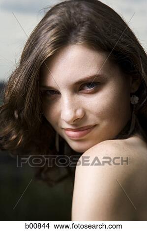 Portrait of a young woman smiling View Large Photo Image Picture - Portrait of a young woman smiling. Fotosearch