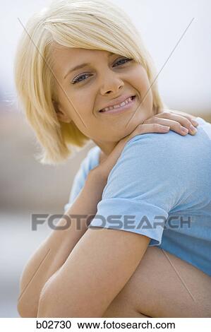 Portrait of a young woman smiling View Large Photo Image Stock Image - Portrait of a young woman smiling. Fotosearch