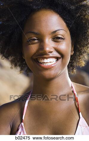 Portrait of a young woman smiling View Large Photo Image Stock Photography - Portrait of a young woman smiling. Fotosearch