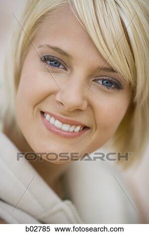 Portrait of a young woman smiling View Large Photo Image Stock Photography - Portrait of a young woman smiling. Fotosearch
