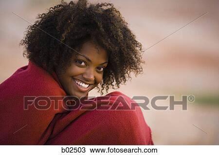 Portrait of a young woman wrapped in a towel and smiling View Large Photo Image Stock Image - Portrait of a young woman wrapped in a towel and smiling. Fotosearch