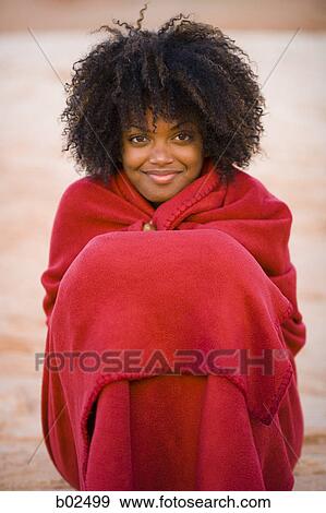 Portrait of a young woman wrapped in a towel and smiling View Large Photo Image Stock Photo - Portrait of a young woman wrapped in a towel and smiling. Fotosearch