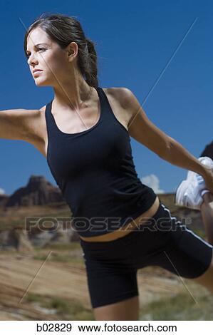 Stock Photo - Close-up of a young woman exercising. Fotosearch