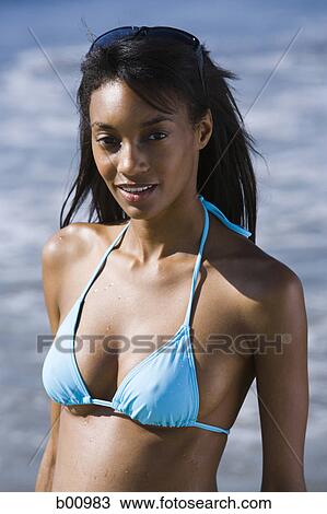 Portrait of a young woman on the beach View Large Photo Image Stock Image - Portrait of a young woman on the beach. Fotosearch