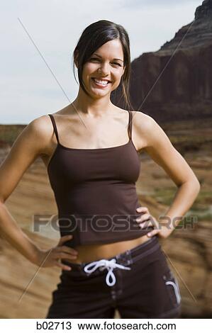 Portrait of a young woman smiling View Large Photo Image Stock Image - Portrait of a young woman smiling. Fotosearch