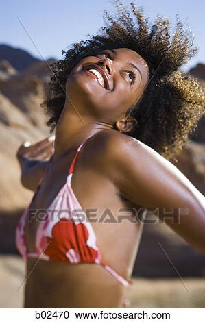 Stock Image - Profile of a young woman dancing. Fotosearch