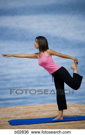 Profile of a young woman exercising View Large Photo Image Stock Photograph - Profile of a young woman exercising. Fotosearch