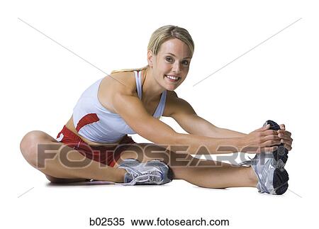 Close-up of a young woman exercising View Large Photo Image Stock Photography - Close-up of a young woman exercising. Fotosearch