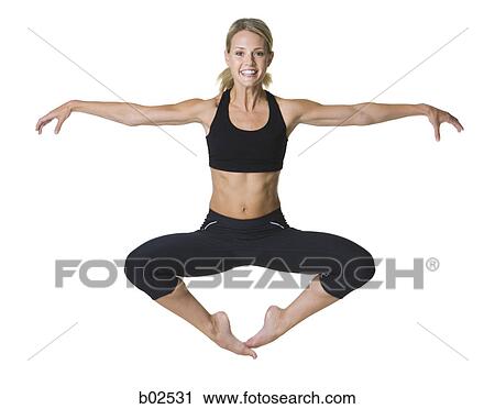 Portrait of a young woman exercising View Large Photo Image Stock Image - Portrait of a young woman exercising. Fotosearch